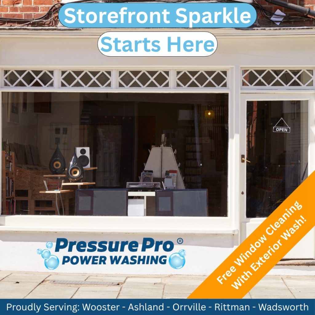 Exterior view of a storefront featuring large windows, displaying items inside. A promotional sign reads 'Storefront Sparkle Starts Here' and 'Free Window Cleaning With Exterior Wash!' for a power washing service. The logo of 'PressurePro Power Washing' is prominently displayed.